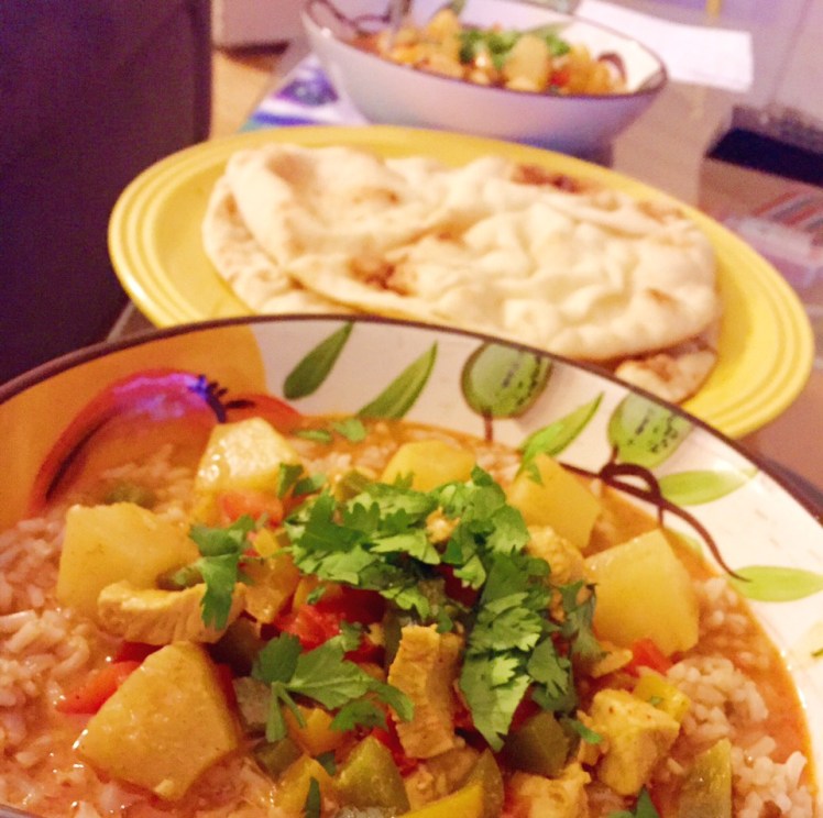 Pineapple Chicken Curry with a side of naan.